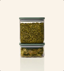 Glass airtight containers stacked with cotton balls and flossers