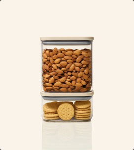 Glass airtight containers stacked with cotton balls and flossers