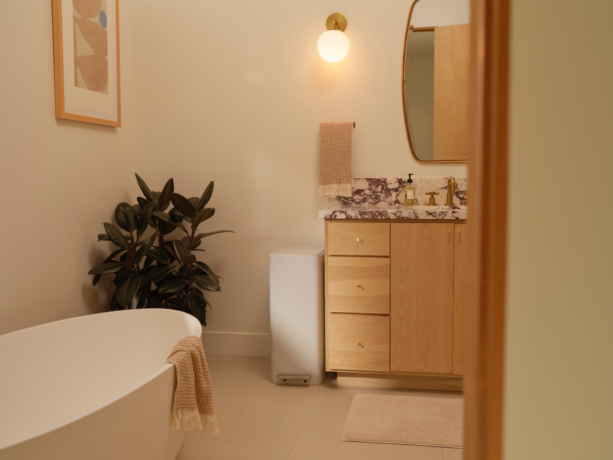 White Caraway trash can near bathroom vanity